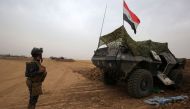 Iraqi forces gather at their camp on the front line in the northwestern town of Fishkhabur, near the borders with Syria and Turkey, on October 28, 2017.  AFP / AHMAD AL-RUBAYE
