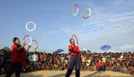 This photograph taken on October 28, 2017 shows Rohingya refugee children watching the Bangladeshi theatre group 