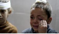 A wounded child cries as he receives treatment after Assad Regime forces attacked to the de-conflict zone Sabqa city of Damascus, at a hospital in the Eastern Ghouta region of Damascus, Syria on October 29, 2017. Samir Tatin - AA