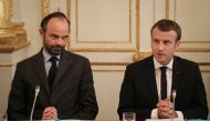 French Prime Minister Edouard Philippe (L) and French President Emmanuel Macron take part in a meeting with New Caledonia representatives in the Murat lounge, at the Elysee palace in Paris on October 30, 2017.  AFP /Ludovic Marin