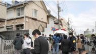 Members of the media gather in front of an apartment building where media reported nine bodies were found in Zama, Kanagawa Prefecture, Japan in this photo taken by Kyodo on October 31, 2017.(Photo: Kyodo/via Reuters).