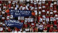 FILE: Hong Kong fans hold banners and character signs which read 