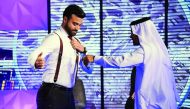 Dr Khalid Al Ali testing the results of Fouad Maksoud’s Nano-Shielding Textile Machine on Stars of Science.