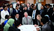 Britain's Prince Charles (C) meets participants during the Commonwealth Youth Event at the Nottingham University Campus in Semenyih, outside Kuala Lumpur on November 3, 2017. AFP / Mohd Rasfan
