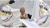 (File Photo) This file photo taken on May 23, 2014 shows Italian anti-establishment 5-Star Movement (M5S) party leader, Beppe Grillo, giving a speech as supporters wave flags in Rome's Piazza San Giovanni.  AFP / Andreas SOLARO