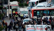 Picketers block the Placa Cerda square in Barcelona during a general strike to protest the jailing of eight sacked regional lawmakers on November 8, 2017. / AFP / Josep LAGO.