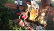 Villagers cover the body of Myanmar land rights activist Htay Aung, who was beaten to death by a mob, Nov. 1, 2017.