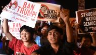 Student activists hold anti US President Donald Trump banners during a lightning rally before the start of the 31st Association of Southeast Asian Nations (ASEAN) Summit, in Manila on November 12, 2017.  / AFP / Noel CELIS
