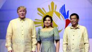 U.S. President Donald Trumpposes with Philippine President Rodrigo Duterte and his partner Cielito Avanceno before the Special Gala Celebration of the 50th Anniversary of ASEAN in Manila, Philippines November 12, 2017. Reuters/Aaron Favila