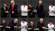 A combination photo of US President Donald Trump registers his surprise as he realizes other leaders, including Vietnam's Prime Minister Nguyen Xuan Phuc and President of the Philippines Rodrigo Duterte, are crossing their arms for the traditional 