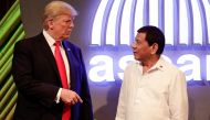 US President Donald J. Trump (L) talks to Philippine President Rodrigo Duterte (R) before the opening ceremony of the 31st Association of Southeast Asian Nations (ASEAN) Summit in Manila on November 13, 2017.  / AFP / POOL / Mark R. CRISTINO