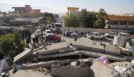 Collapsed buildings are seen in Derbendihan district of Sulaymaniyah, Iraq on November 13, 2017 following a 7.3 magnitude earthquake that hit the Iraq and Iran. / ( Yunus Kele? - Anadolu Agency ).