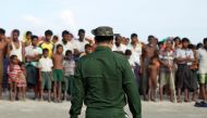 Rohingya Muslims wait to cross the border to Bangladesh, in a temporary camp outside Maungdaw, northern Rakhine state, Myanmar November 12, 2017. Picture taken on November 12, 2017. Reuters/Wa Lone