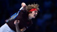 Germany's Alexander Zverev returns against Switzerland's Roger Federer during their men's singles round-robin match on day three of the ATP World Tour Finals tennis tournament at the O2 Arena in London on November 14, 2017. / AFP / Glyn KIRK

