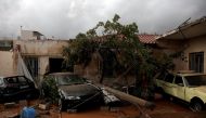 Destroyed cars are seen inside a yard following a heavy rainfall in the town of Mandra, Greece, November 15, 2017. REUTERS/Alkis Konstantinidis