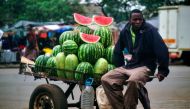 A vendor sells watermelons at a marketplace in the Mbare suburb of Harare on November 16, 2017, a day after the military took power and announced plans to arrest 