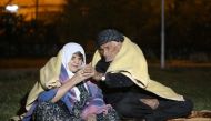 People sit outside as a precaution during night at Darbandikhan district of Suleymaniyah after an earthquake measuring 7.3 on the Richter scale rocked northern Iraq and Iran on 13th of November 2017, in Suleymaniyah, Iraq on November 15, 2017. (Feriq Fere