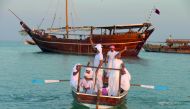 Qatari sailors wave goodbye as they head towards Fath Al Kheir which will take them on a month-long journey to Oman and Kuwait and back.
