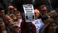 Refugee advocates hold placards as they participate in a protest in Sydney, Australia, against the treatment of asylum-seekers at Australia-run detention centres located at Nauru and Manus Island, November 18, 2017. REUTERS/David Gray