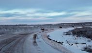 Cars are seen on the Inuvik Tuktoyaktuk highway on Nov 15, 2017 in Inuvik, Canada. PHOTO: AFP.