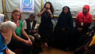 EU's diplomatic chief Federica Mogherini (2L) talks to Rohingya refugees during her visit to the Kutupalong refugee camp in the Bangladeshi distrcit of Ukhia on November 19, 2017. /AFP /Munir UZ ZAMAN