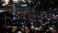 An image of Rohingya refugees line up to receive food supplies at Hakim Para refugee settlement near Cox's Bazar, Bangladesh, November 21, 2017. REUTERS/Susana Vera