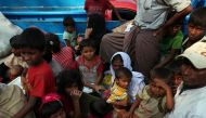 Rohingya refugees who arrived from Myanmar wait on a truck that will take them to a refugee camp from a relief centre in Teknaf, Bangladesh, October 25, 2017. REUTERS/Hannah McKay.