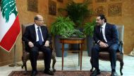 A handout picture provided by the Lebanese photo agency Dalati and Nohra on November 22, 2017 shows Lebanese prime minister Saad Hariri meeting with President Michel Aoun at the presidential palace in Baadba, on the outskirsts of the Lebanese capital Beir