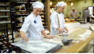 Bakers Maria Malinen and Samuli Malmi of the Finnish food company Fazer bake the world's first mass-delivered bread made of insects in the bakery in Helsinki, Finland November 23, 2017. REUTERS/Attila Cser
