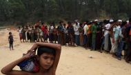 Rohingya refugees line up to receive blankets outside Kutupalong refugee settlement near Cox's Bazar, Bangladesh, November 24, 2017. REUTERS/Susana Vera
