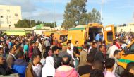 Egyptians gather around ambulances following a gun and bombing attack on the Rawda mosque near the North Sinai provincial capital of El-Arish on November 24, 2017.  AFP 
