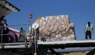 Workers unload aid shipment from a plane at the Sanaa airport, Yemen November 25, 2017. REUTERS/Stringer
