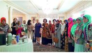 The wives of ambassadors from Asian and European embassies as well as expatriates from various countries sample various Indonesian coffees at the event . 