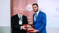 An official of Naseem Al Rabeeh Medical Centre receiving the award . 
