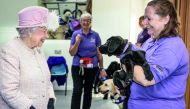 Britain's Queen Elizabeth visits the Canine Partners charity in Midhurst, Britain, November 30, 2017. Reuters/Richard Pohle
