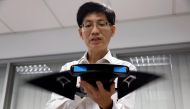 NUS Department of Mechanical Engineering researcher Chew Chee Meng showcases their aquatic robot manta ray 