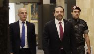 Lebanese Prime Minister Saad Hariri (C) arrives to attend a cabinet meeting at the presidential palace of Baabda, east of the capital Beirut, on December 5, 2017. / AFP