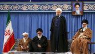 A handout photo provided by the office of Iran's supreme leader Ayatollah Ali Khamenei on December 6, 2017 shows him (R) listening to President Hassan Rouhani (2nd-R) speaking, during a meeting with the Iranian government in the capital Tehran, also atten