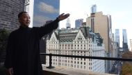 Billionaire Guo Wengui, who is seeking asylum in the United States after accusing officials in his native China of corruption, poses at his New York City apartment on November 28, 2017. / AFP.