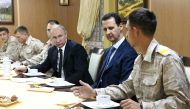 Russian President Vladimir Putin (3 R) meets with President of Syria, Bashar al-Assad (2 R) during his visit at the Hmeymim base in Syria's Latakia on December 11, 2017.  Kremlin Press Office