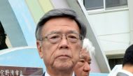 Okinawa Governor Takeshi Onaga shows a picture of a window that fell from a US helicopter onto a school sports field in front of the Futenma Daini Elementary School in Ginowan, Okinawa prefecture, Japan December 13, 2017. Kyodo/via REUTERS