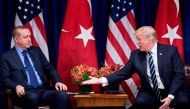 (FILES) This file photo taken on September 21, 2017 shows US President Donald Trump reaching to shake Turkey's President Recep Tayyip Erdogan's hand before a meeting at the Palace Hotel during the 72nd United Nations General Assembly in New York City.  AF