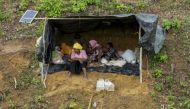 A file photo of Rohingya refugees take shelter in a no-man's land between Bangladesh and Myanmar. AFP / K.M. Asad