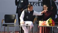 Newly elected President of the Indian National Congress party Rahul Gandhi (C) gestures next her mother and former party President Sonia Gandhi during a ceremony at congress headquarters in New Delhi on December 16, 2017. / AFP.
