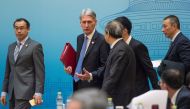 Britain's Chancellor of the Exchequer Philip Hammond and Chinese Vice Premier Ma Kai attend the UK-China Economic Financial Dialogue at the Diaoyutai State Guesthouse in Beijing, China December 16, 2017. REUTERS/Fred Dufour/Pool.