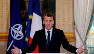 French President Emmanuel Macron speaks during a press conference with NATO Secretary-General at the Elysee Palace in Paris, on December 19, 2017. / AFP / PHILIPPE WOJAZER