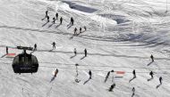 This file photo taken on November 26, 2016 shows people skiing down a slope on the opening weekend of the ski season at Val Thorens ski resort, in the French Alps. / AFP.