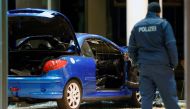 A damaged car is pictured inside the party headquarters of the Social Democratic Party of Germany (SPD) after it crashed into the building in Berlin, Germany, December 25, 2017. REUTERS/Hannibal Hanschke