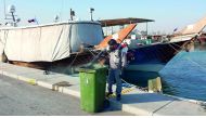 A Municipal official takes part in combating drive.