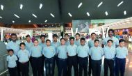 Stallions Cricket Academy players and officials pose for a photograph prior to their departure for Oman at the Hamad International Airport in Doha on Saturday.